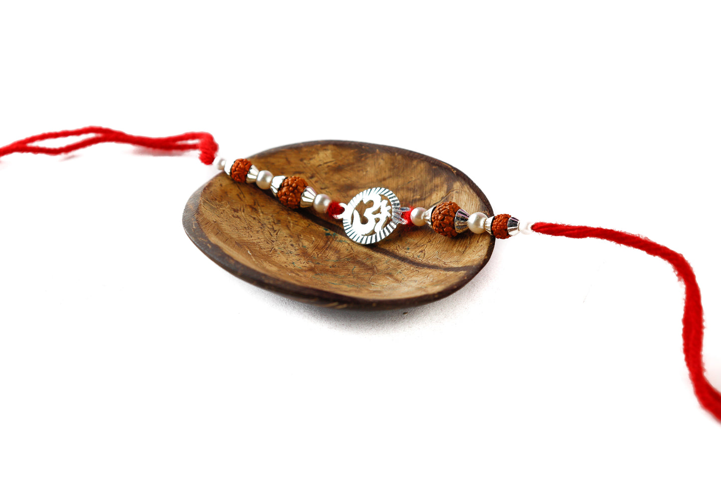 Traditional Silver Rakhi with Oval Om Motif - Top View