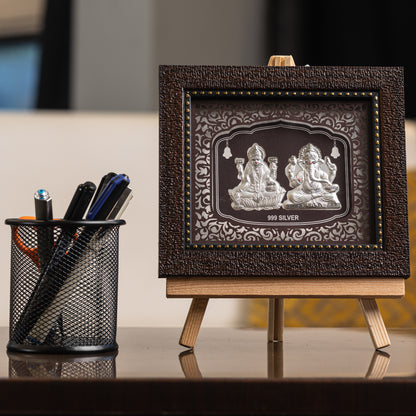 "Front view of pure silver  Ganesh Laxmi  frame by Hem Jewels® placed on a table."	