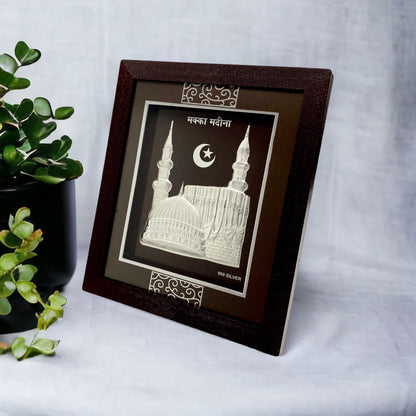 "Angled view of the pure silver Meeca frame by Hem Jewels® placed on a wooden table."	