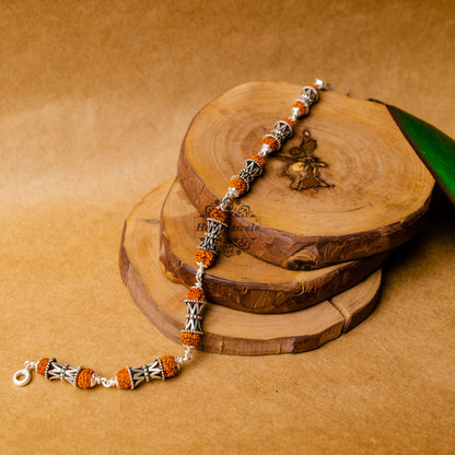 View showing Silver Rudraksha Rakhi with Damru Beads