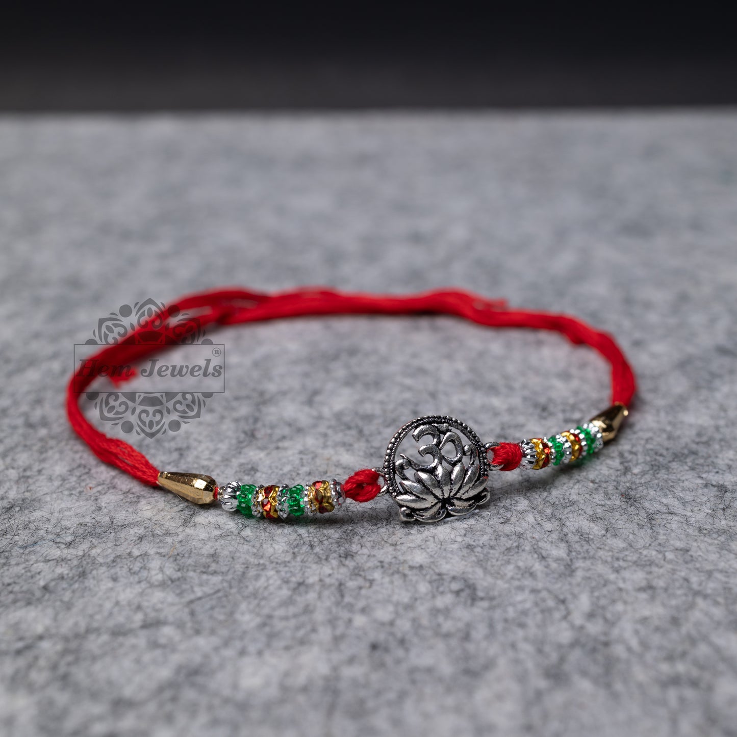 Traditional Silver Rakhi with Spiritual Om Motif - Top View