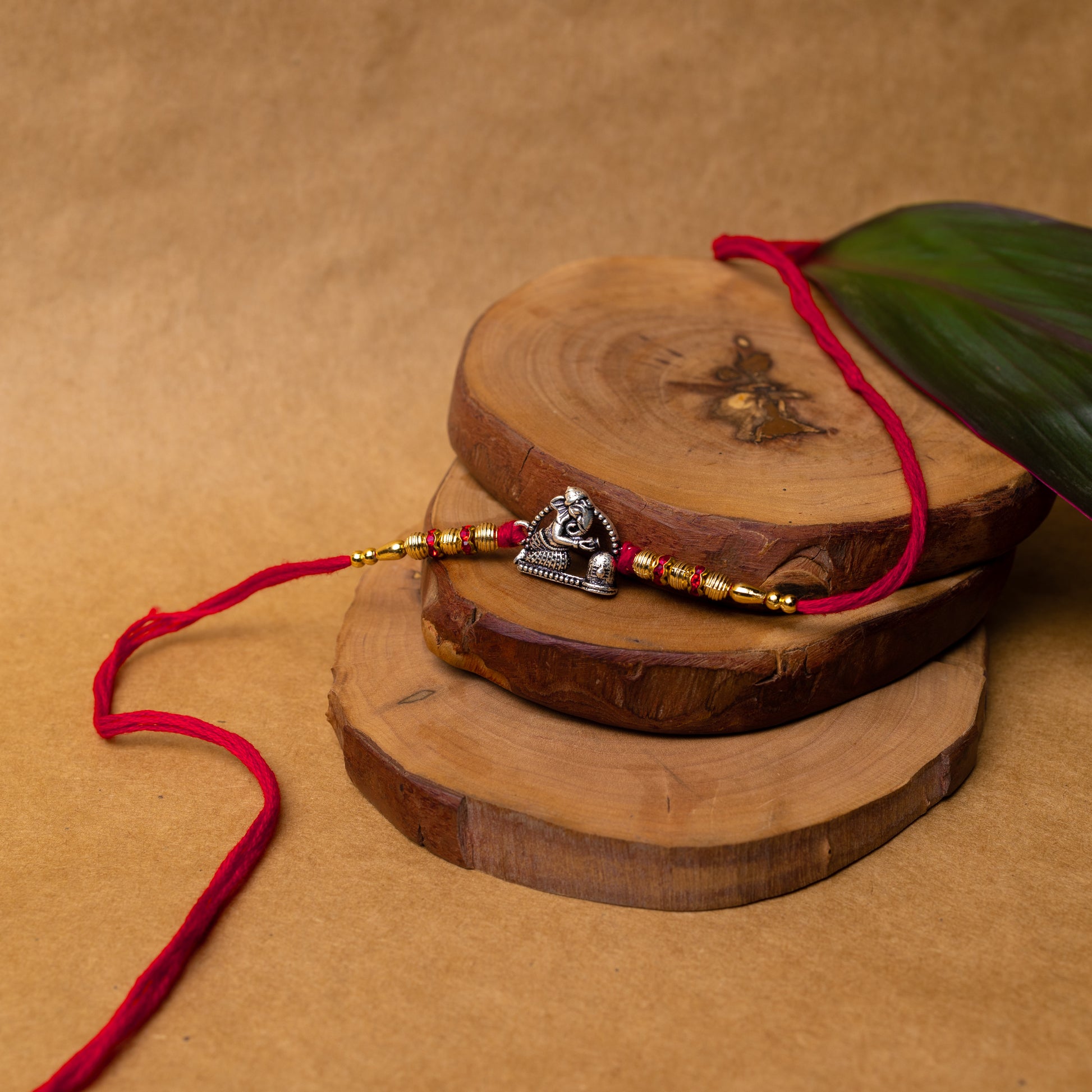 View showing Artisanal Silver Rakhi with Ganesh with Shivling Motif