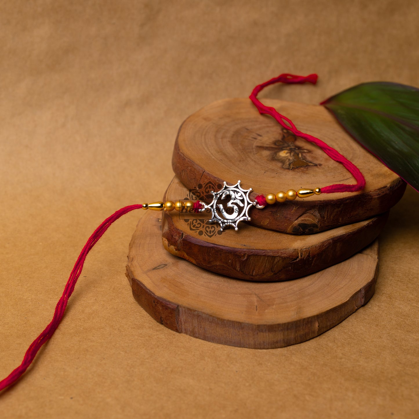 View showing Handcrafted Silver Rakhi with Elegant Om Motif