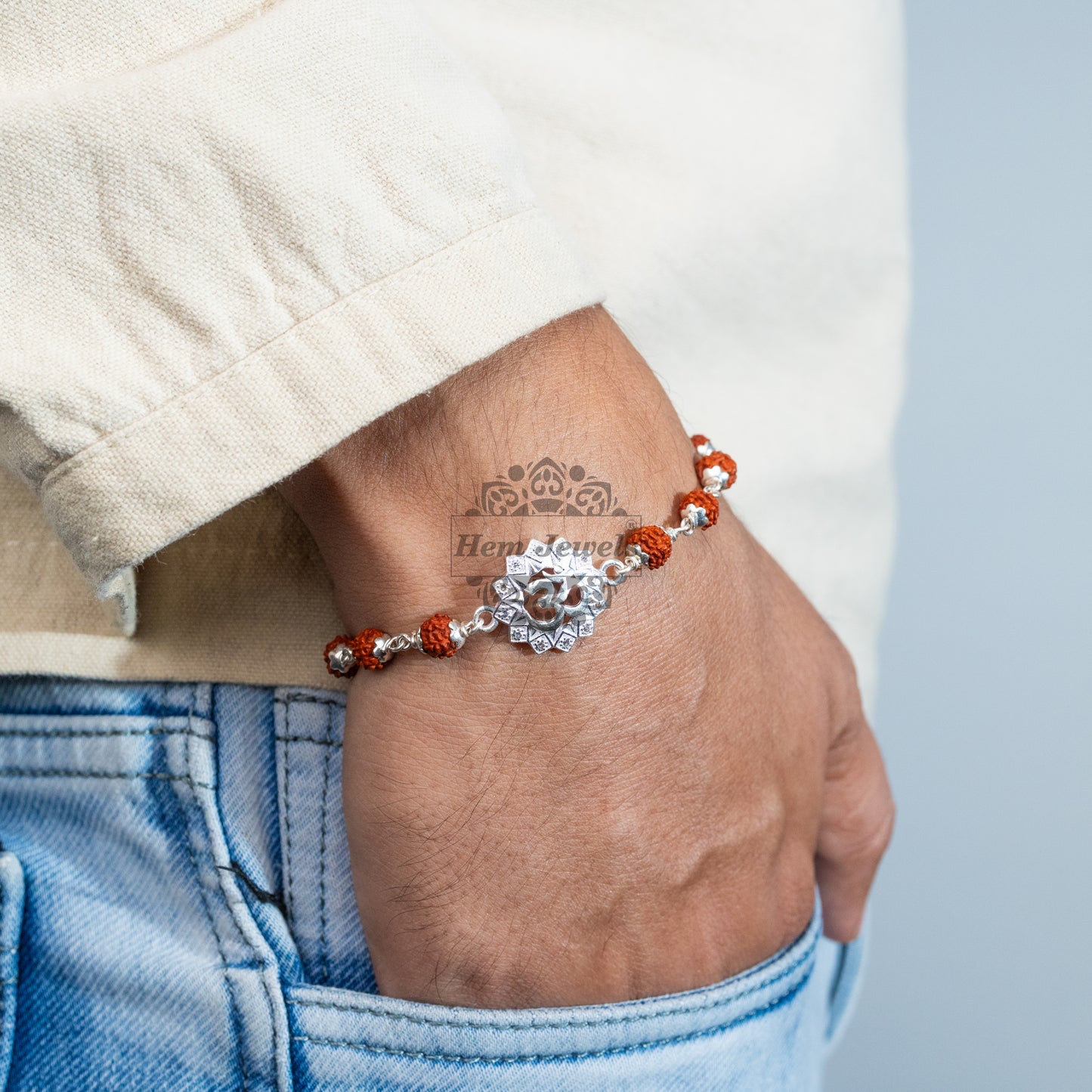 A man Elegant Silver Rakhi with Diamond Studded OM Motif