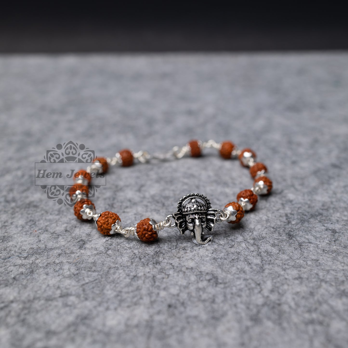 Silver Rudraksha Rakhi with Ganesh face  Motif - Top View