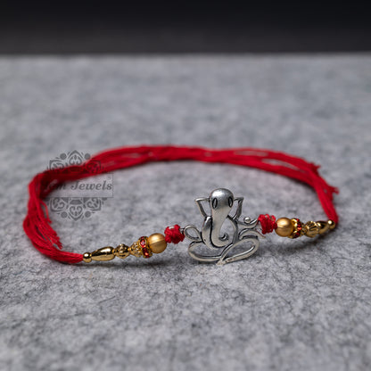 Traditional Silver Rakhi with Cute Ganesha Motif - Top View