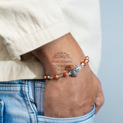 A man Silver Rudraksha Rakhi with Mahadev Trishul Motif