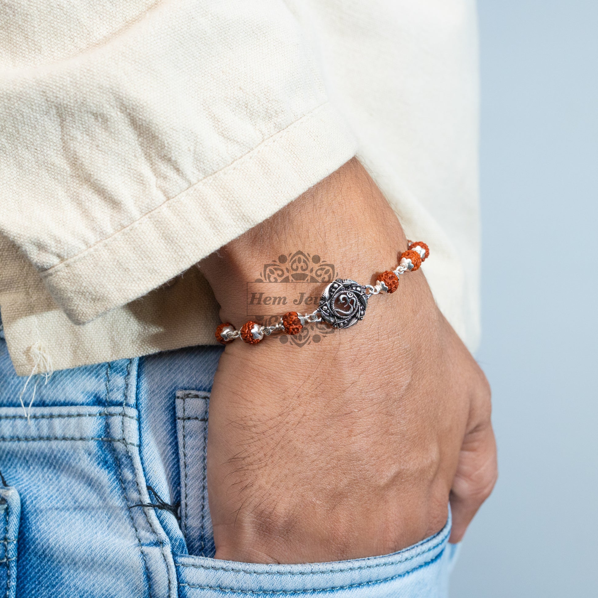 A man Silver Rudraksha Rakhi with Om in Mandala Motif