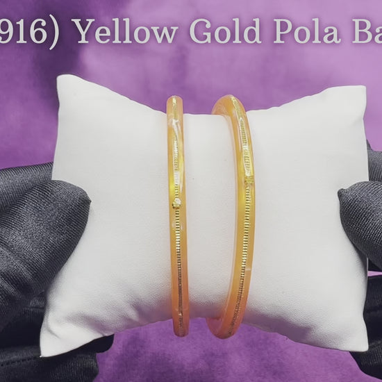 "Video showcasing Hem Jewels Gold Pola Bangles from various angles, highlighting exquisite craftsmanship and timeless elegance."