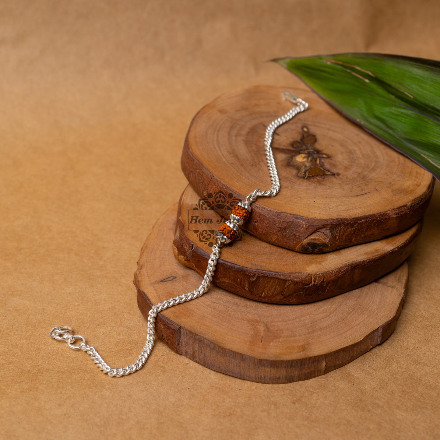 View showing Silver Rakhi with 2 Silver Capped Rudraksh Motif