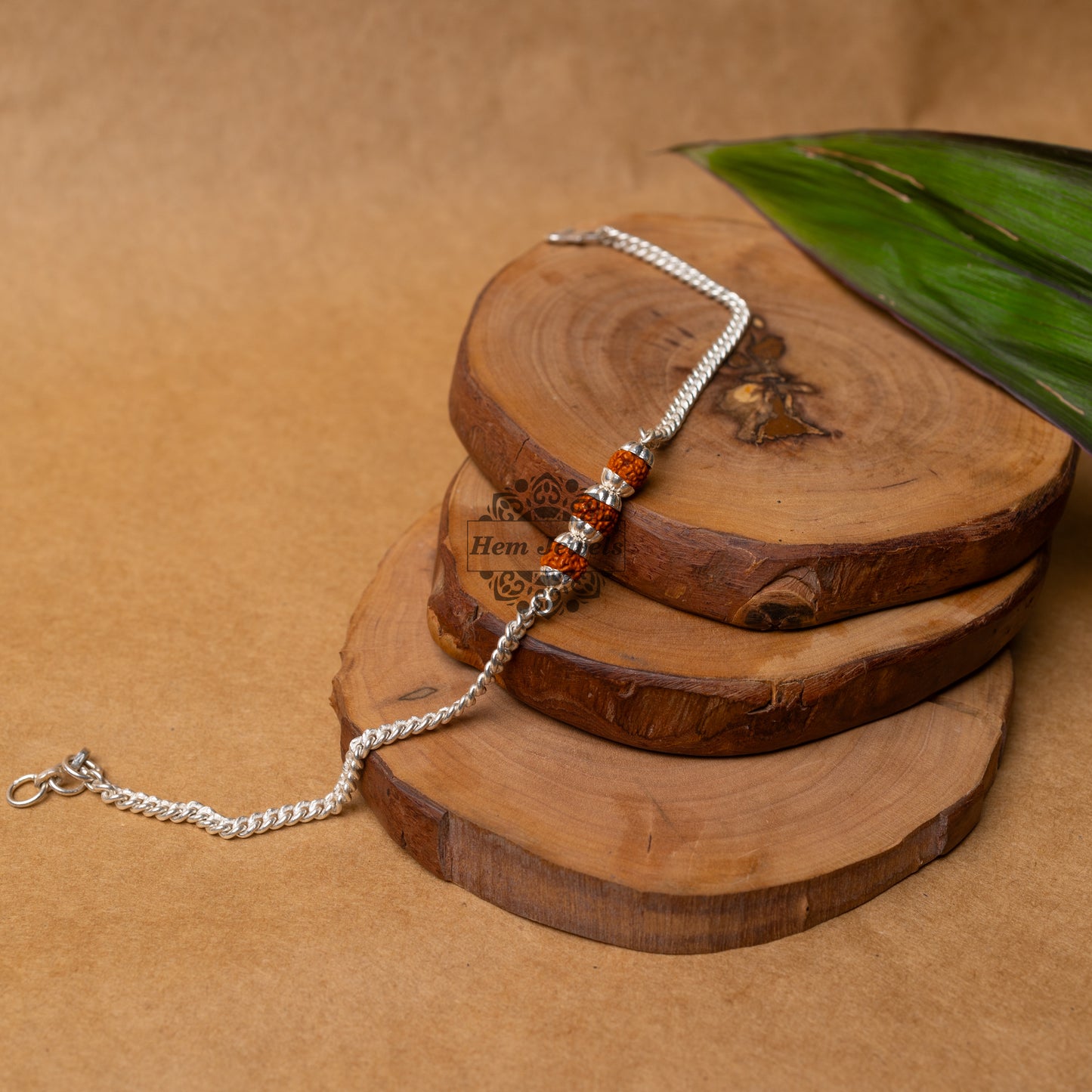 View showing Silver Rakhi with 3 Silver Capped Rudraksh Motif