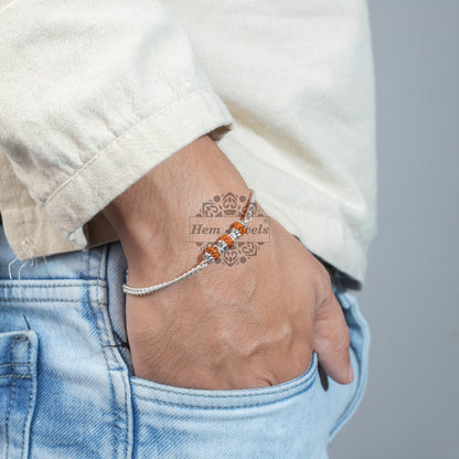 A man Silver Rakhi with 3 Silver Capped Rudraksh Motif