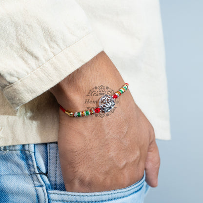 A man Traditional Silver Rakhi  with  Spiritual OmMotif